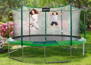 5 Types of Trampolines for Different Uses 3 kids jumping on a Machrus upperbounce trampoline on a beach